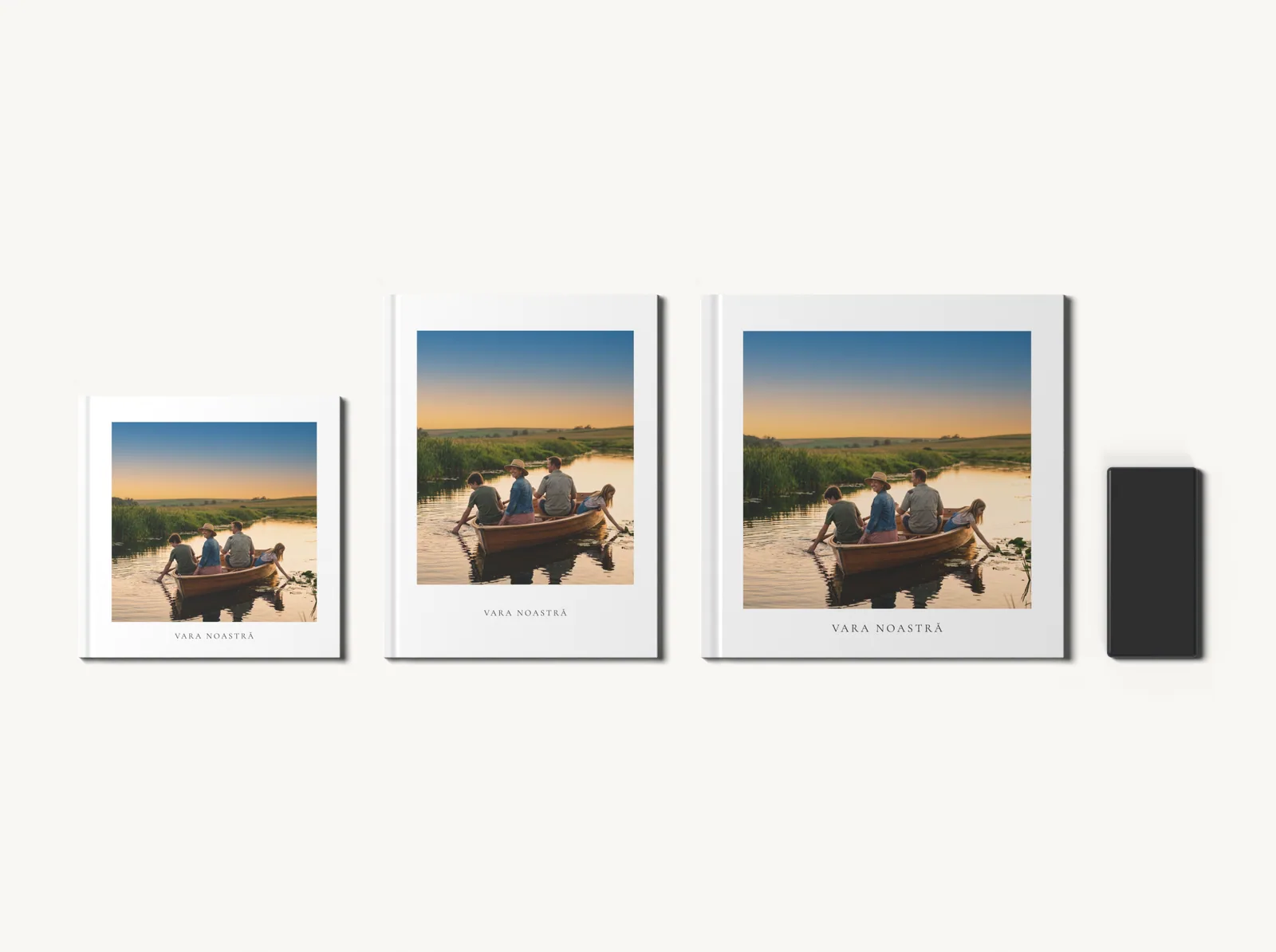 Albumul în tema Album alb în formatele 20 × 20, 21 × 28 și 28 × 28 cm, la scară, lângă un telefon
