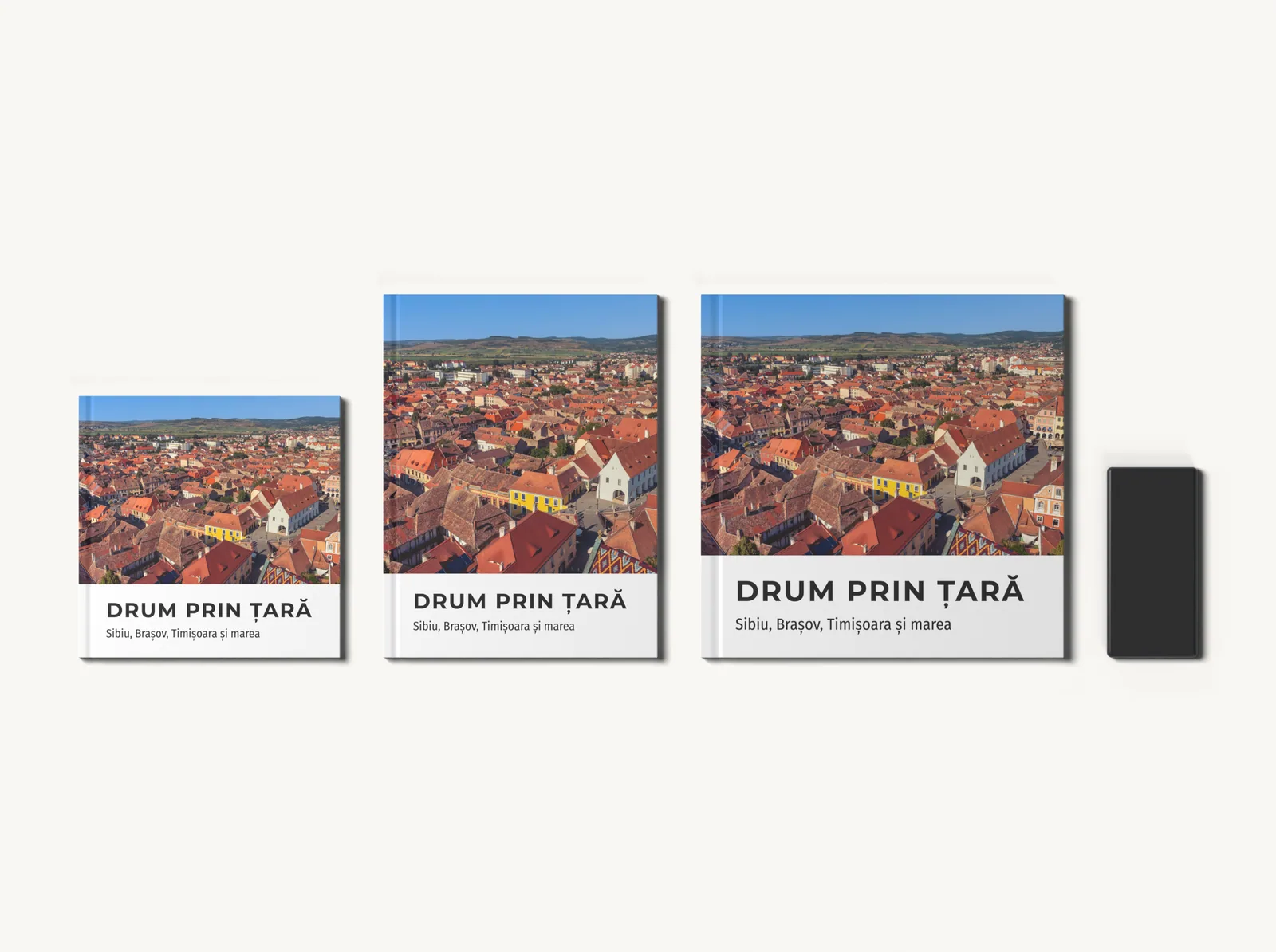 Albumul în tema Explorare în formatele 20 × 20, 21 × 28 și 28 × 28 cm, la scară, lângă un telefon