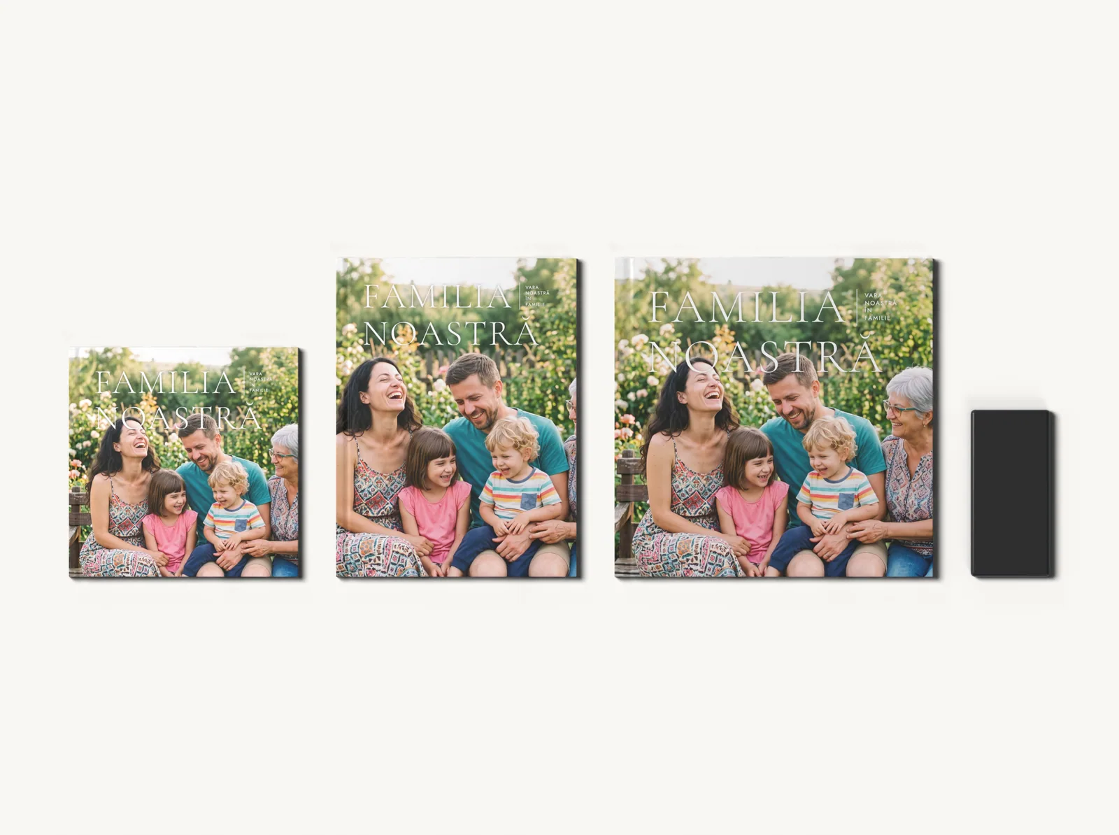Albumul în tema Familie elegantă în formatele 20 × 20, 21 × 28 și 28 × 28 cm, la scară, lângă un telefon